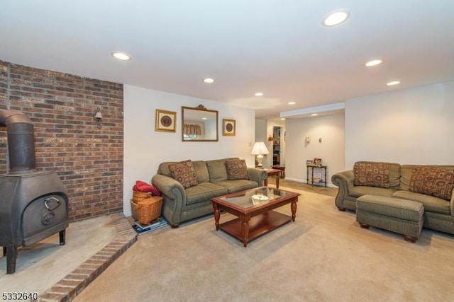 carpeted living room with a wood stove