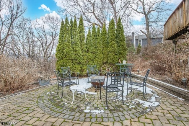 view of patio featuring an outdoor fire pit