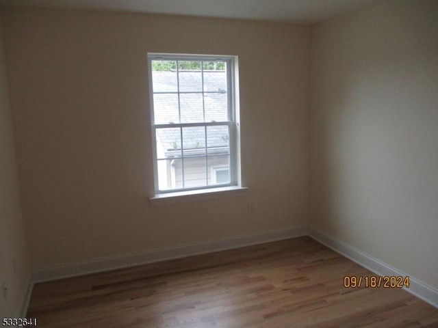 empty room featuring hardwood / wood-style floors