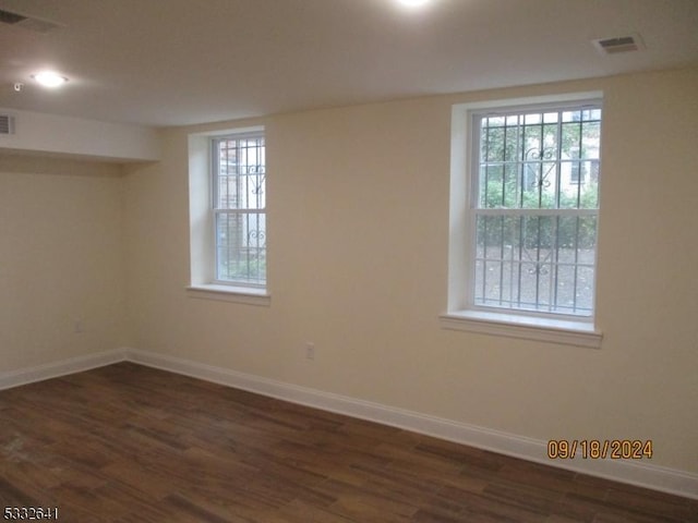 empty room featuring dark wood-type flooring