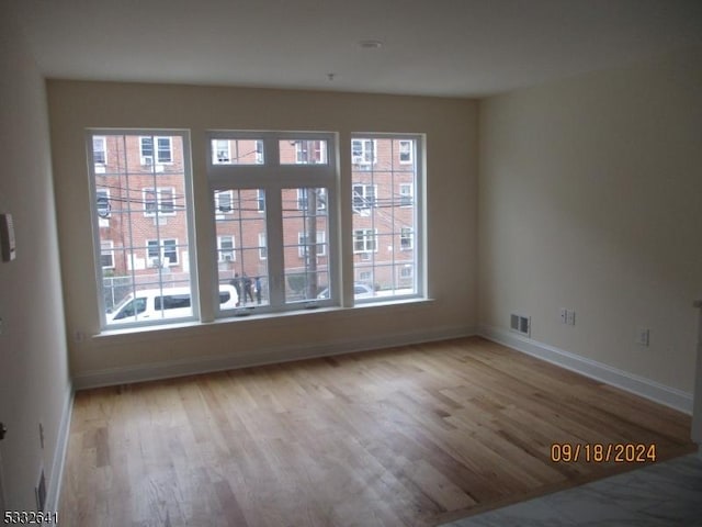 empty room featuring light hardwood / wood-style floors