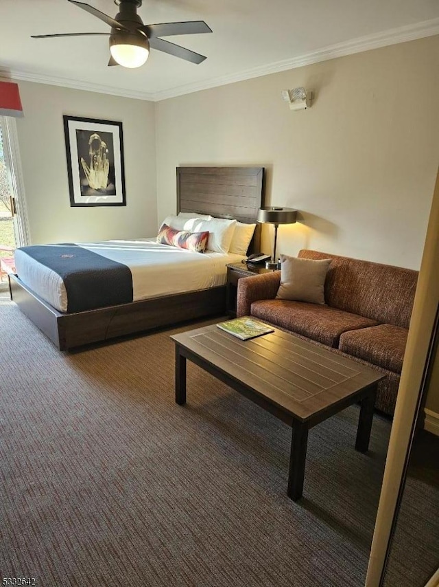 carpeted bedroom featuring ceiling fan and ornamental molding