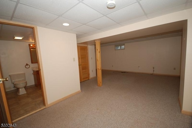 basement featuring carpet flooring