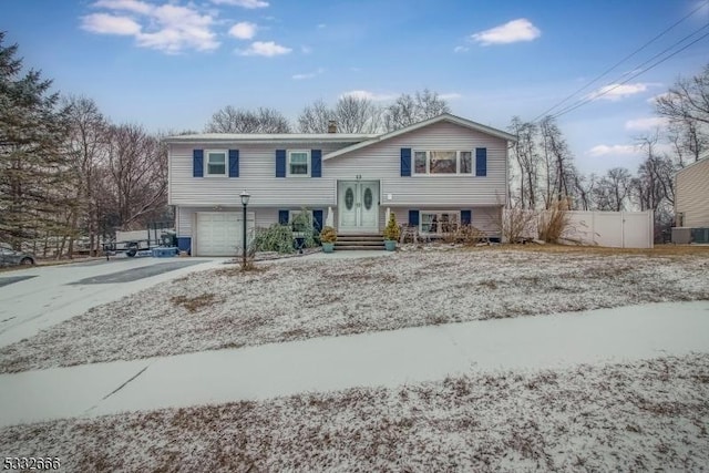 split foyer home featuring a garage