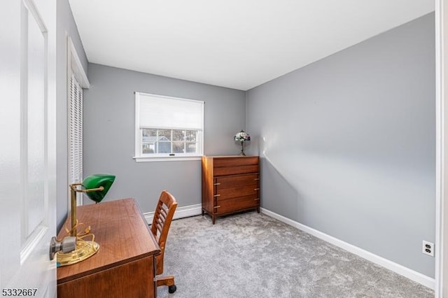 carpeted home office featuring baseboard heating