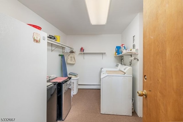 laundry area with a baseboard radiator and washing machine and clothes dryer