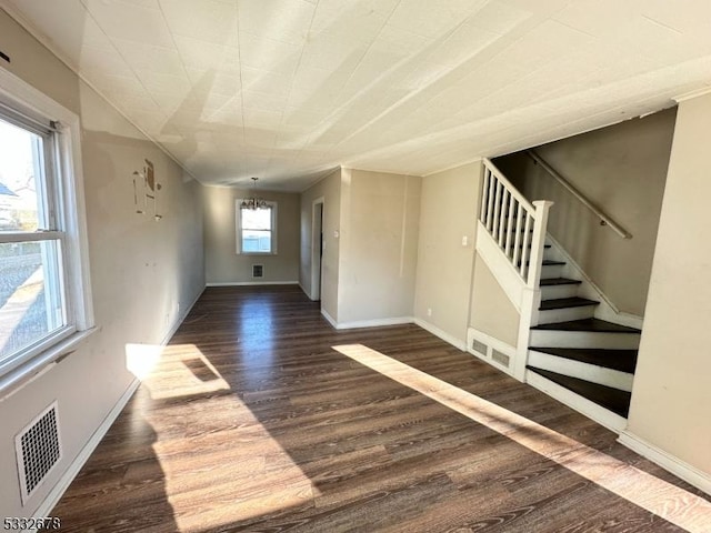 unfurnished room featuring dark hardwood / wood-style floors