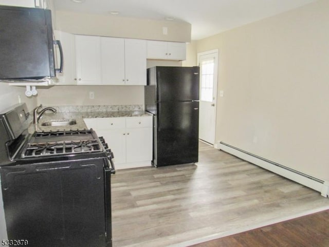 kitchen featuring sink, black appliances, a baseboard radiator, light hardwood / wood-style flooring, and white cabinetry