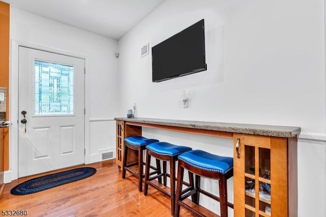 entryway with light hardwood / wood-style flooring