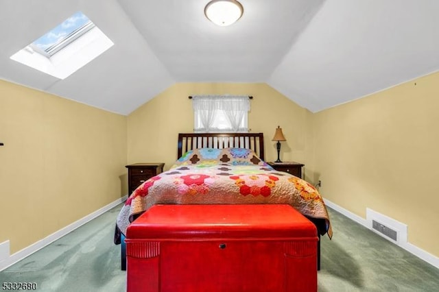 bedroom featuring vaulted ceiling with skylight and carpet