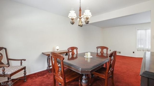 carpeted dining space featuring a chandelier