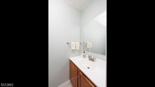 bathroom with vanity and vaulted ceiling