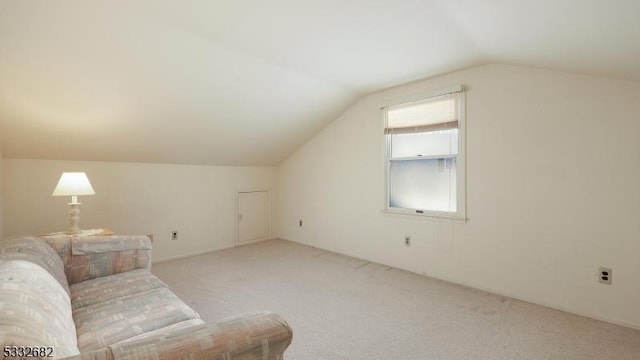 bonus room featuring light carpet and lofted ceiling