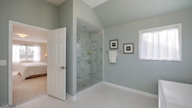 ensuite bathroom with baseboards, vaulted ceiling, a marble finish shower, and ensuite bathroom