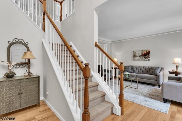 stairway with hardwood / wood-style floors