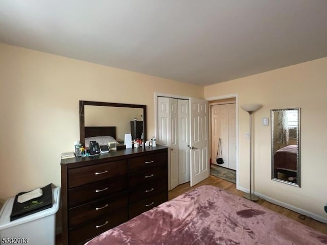 bedroom with hardwood / wood-style floors