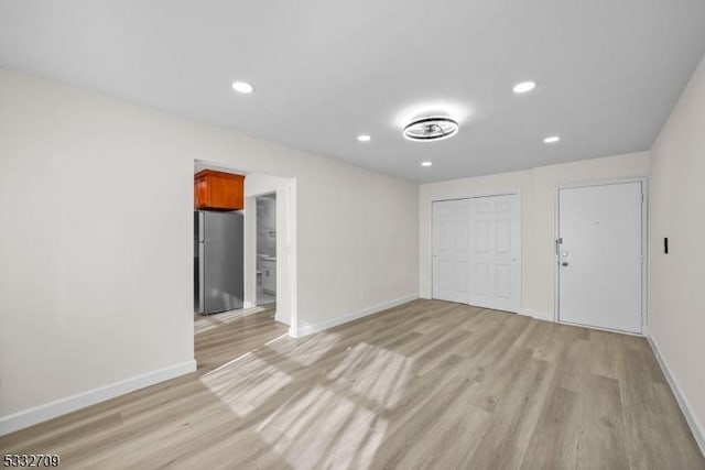 unfurnished room featuring light hardwood / wood-style flooring