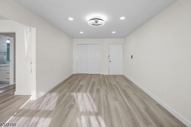 spare room with light hardwood / wood-style floors