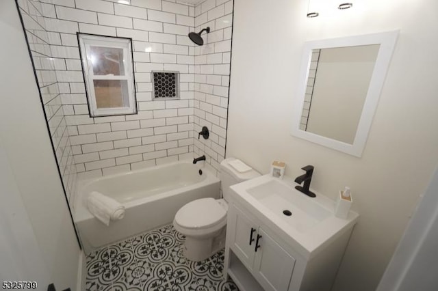 full bathroom with tile patterned flooring, tiled shower / bath combo, toilet, and vanity