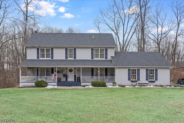 view of front facade with covered porch and a front lawn