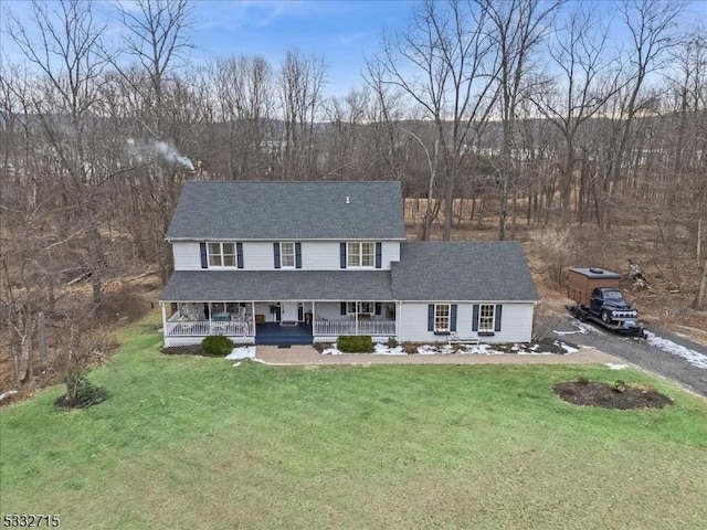 view of front of home featuring a porch and a front yard