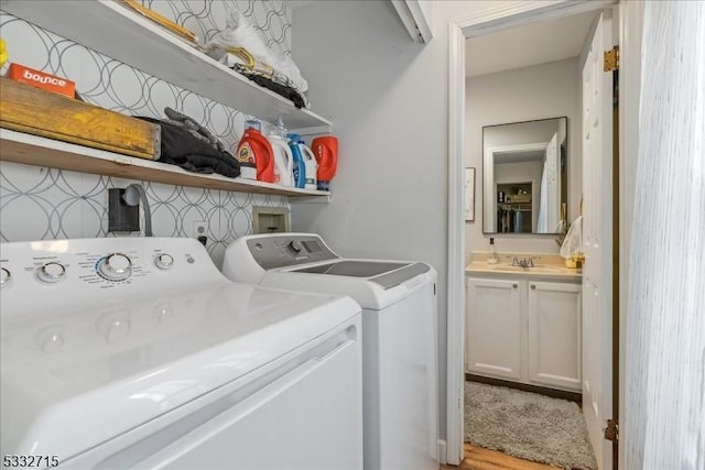 laundry area featuring washer and dryer and sink