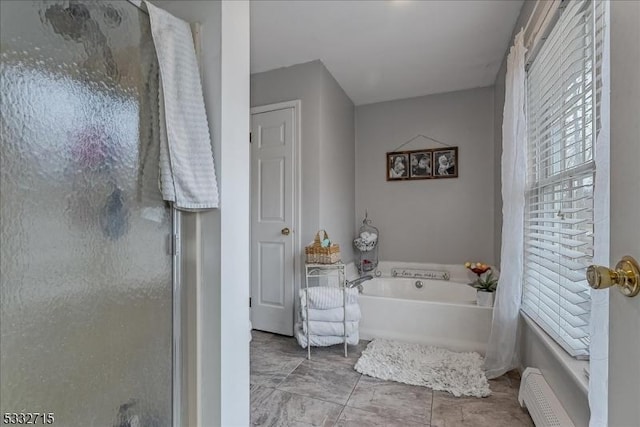 bathroom with separate shower and tub and tile patterned floors