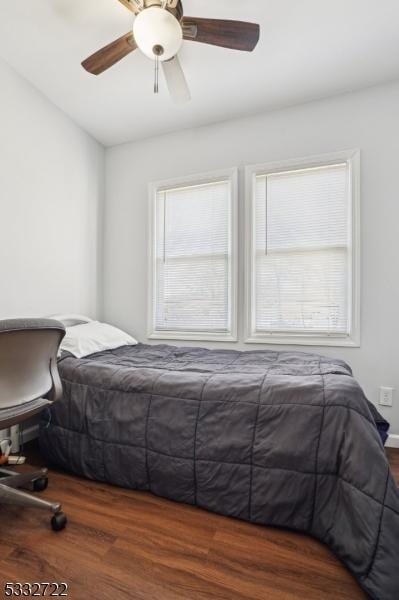 bedroom with ceiling fan and hardwood / wood-style floors