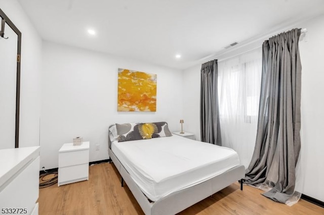 bedroom featuring light wood-type flooring