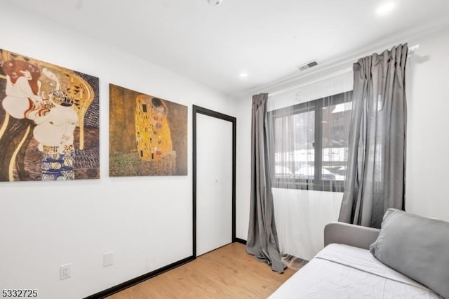 bedroom featuring hardwood / wood-style flooring