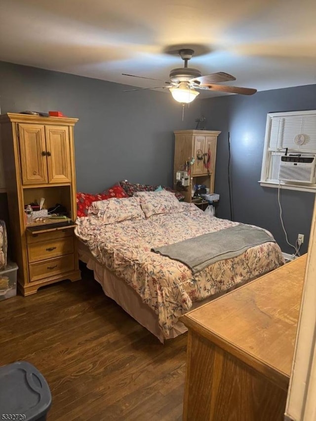 bedroom featuring ceiling fan, cooling unit, and dark hardwood / wood-style flooring