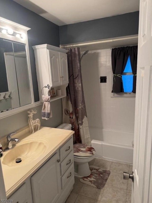 full bathroom with vanity, shower / tub combo with curtain, tile patterned floors, and toilet