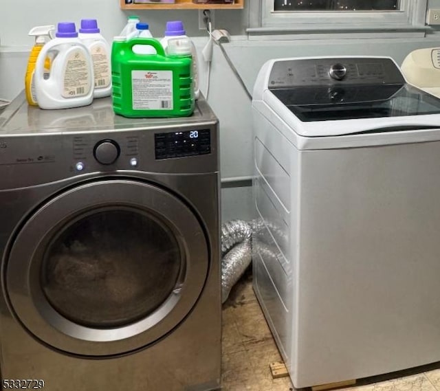 laundry area with washer and clothes dryer