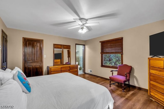 bedroom featuring ensuite bath, ceiling fan, and wood-type flooring