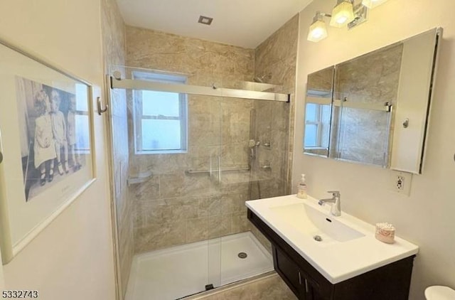 bathroom featuring walk in shower, vanity, and toilet