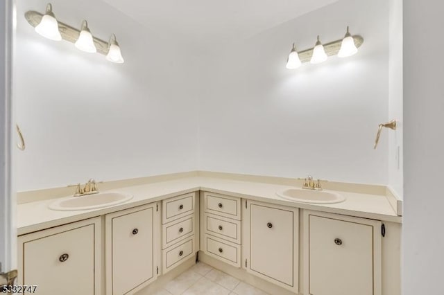 bathroom with tile patterned flooring and vanity