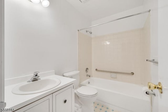 full bathroom featuring toilet, tiled shower / bath combo, and vanity