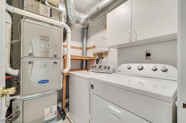 laundry area with cabinets and independent washer and dryer