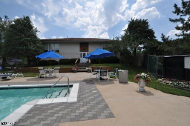 view of pool featuring a patio area