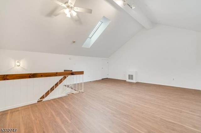 bonus room featuring ceiling fan, lofted ceiling with skylight, and light hardwood / wood-style floors