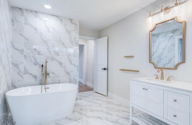 bathroom featuring a bathtub and vanity