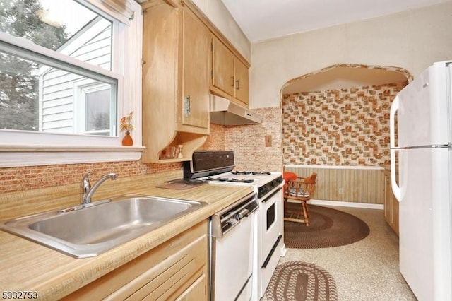 kitchen with white appliances and sink