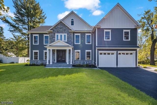 view of front facade featuring a garage and a front lawn