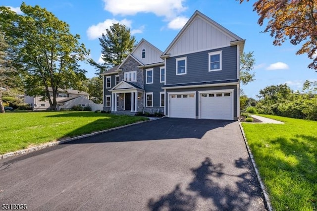 view of front of home with a garage and a front lawn