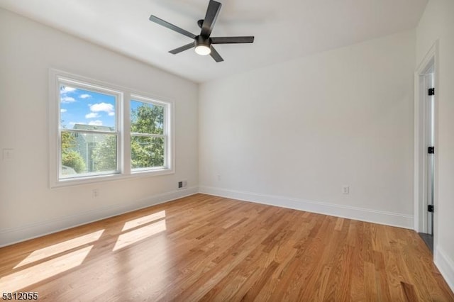 spare room with light hardwood / wood-style floors and ceiling fan