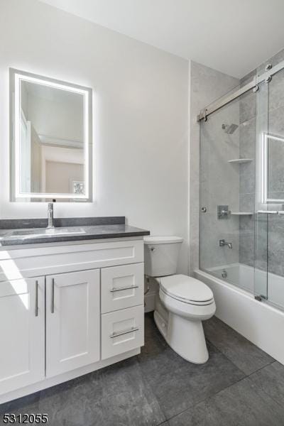 full bathroom featuring shower / bath combination with glass door, vanity, and toilet