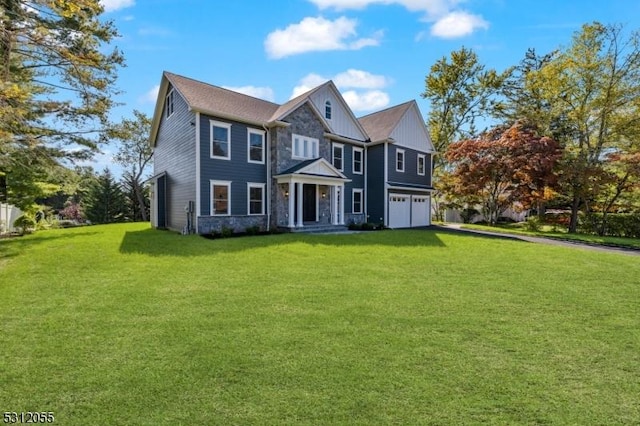 view of front of home featuring a garage and a front lawn