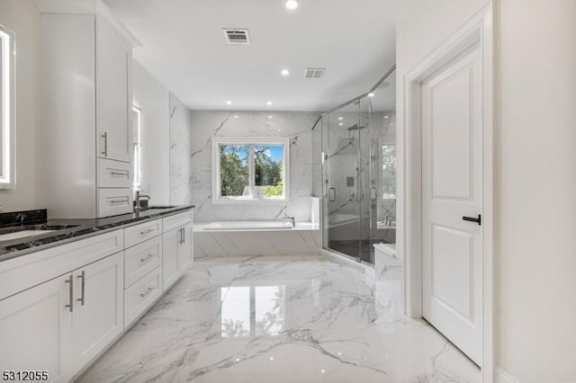 bathroom with vanity and plus walk in shower