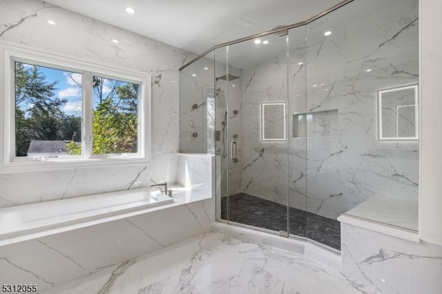 bathroom with shower with separate bathtub