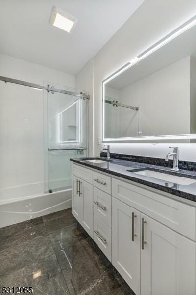 bathroom featuring vanity and shower / bath combination